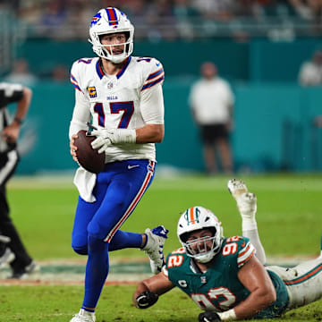 Buffalo Bills quarterback Josh Allen (17) scrambles away from Miami Dolphins defensive tackle Zach Sieler (92) during the second half at Hard Rock Stadium.