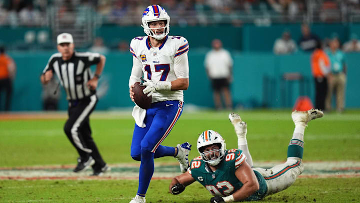 Buffalo Bills quarterback Josh Allen (17) scrambles away from Miami Dolphins defensive tackle Zach Sieler (92) during the second half at Hard Rock Stadium.