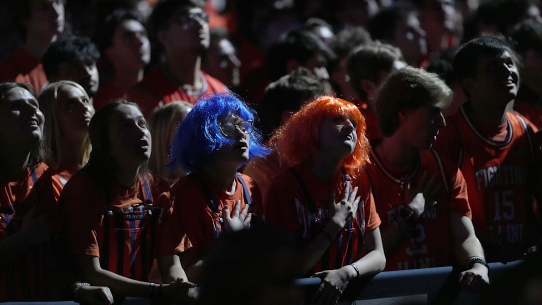 Illinois Fighting Illini fans listen Saturday, April 4, 2026, as the national anthem is sang during a Final Four game against the UConn Huskies at Lucas Oil Stadium in Indianapolis.