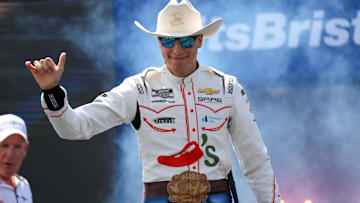 Apr 13, 2025; Bristol, Tennessee, USA; NASCAR Cup Series driver Carson Hocevar (77) during driver introductions for the NASCAR Food City 500 at Bristol Motor Speedway. Mandatory Credit: Randy Sartin-Imagn Images