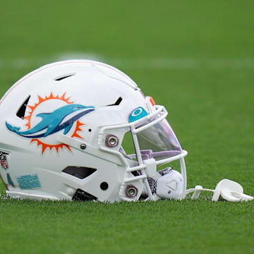 Aug 3, 2022; Miami Gardens, Florida, US; A general view of a Miami Dolphins helmet on the field during training camp at Baptist Health Training Complex. Mandatory Credit: Jasen Vinlove-Imagn Images