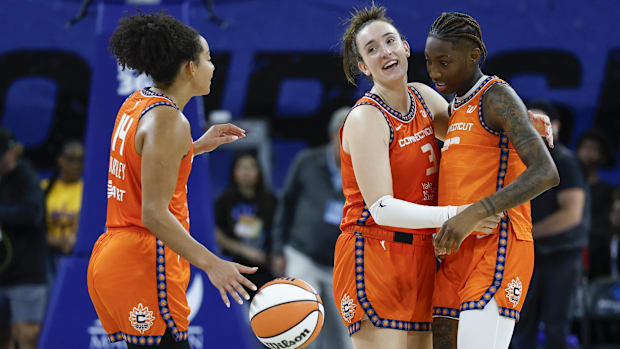 Connecticut Sun guard Marina Mabrey (3) celebrates with guard Saniya Rivers