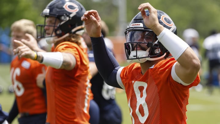 Caleb Williams goes through warmups at practice. His rookie numbers have been projected at a high level by SI.com.