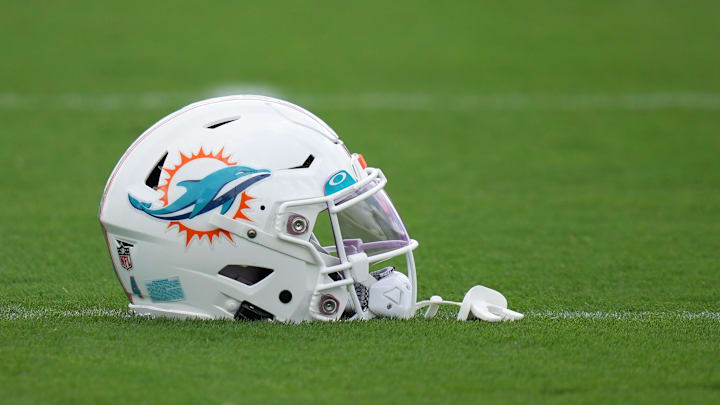 Aug 3, 2022; Miami Gardens, Florida, US; A general view of a Miami Dolphins helmet on the field during training camp at Baptist Health Training Complex. Mandatory Credit: Jasen Vinlove-Imagn Images