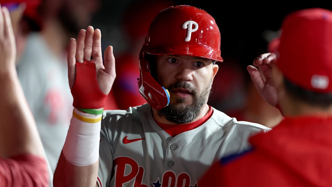 May 24, 2025; West Sacramento, California, USA; Philadelphia Phillies designated hitter Kyle Schwarber (12) is congratulated by teammates in the dugout after scoring a run against the Athletics during the eleventh inning at Sutter Health Park