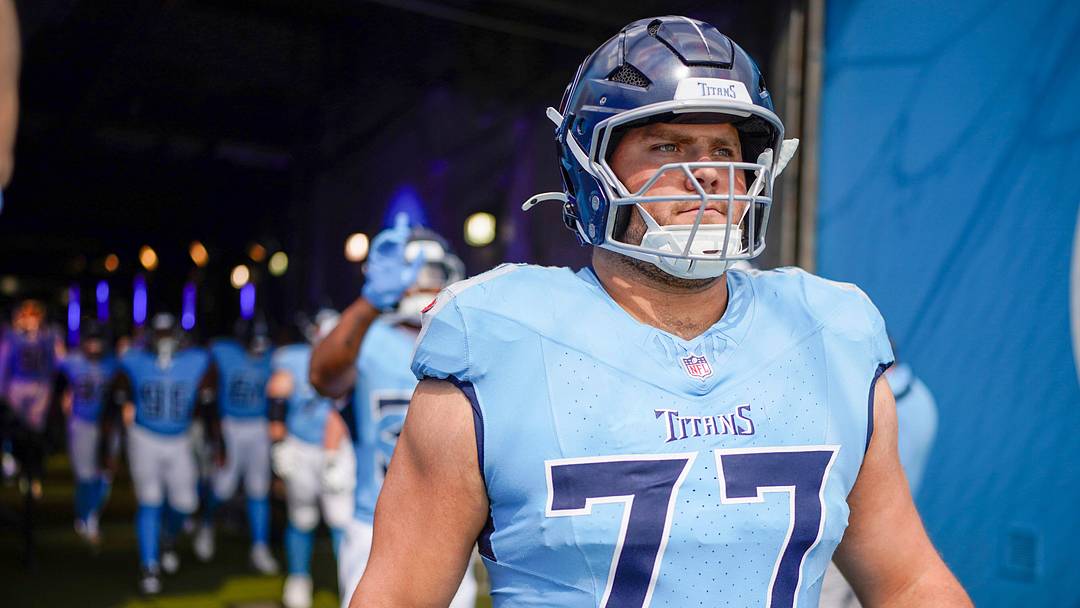 Tennessee Titans offensive tackle Peter Skoronski (77) heads out for warmups before the game against the Indianapolis Colts at Nissan Stadium in Nashville, Tenn., Sunday, Sept. 21, 2025.