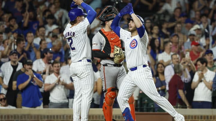 Jun 17, 2024; Chicago, Illinois, USA; Chicago Cubs first baseman Michael Busch (29) celebrates with second baseman Nico Hoerner (2) after hitting a two-run home run against the San Francisco Giants during the sixth inning at Wrigley Field.