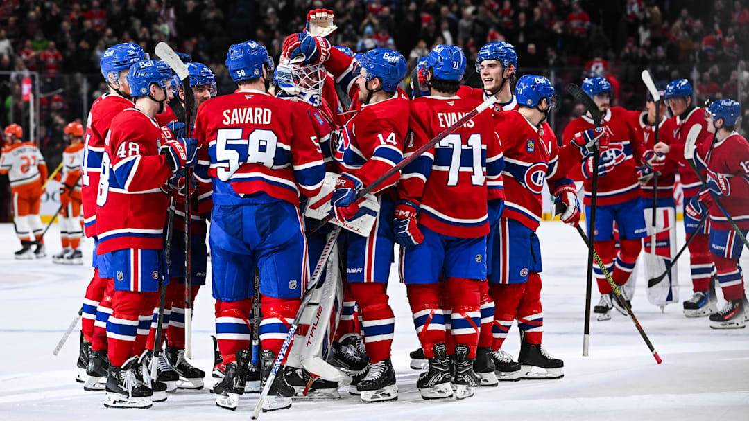 Dec 9, 2024; Montreal, Quebec, CAN; Montreal Canadiens players gather together to celebrate a win against the Anaheim Ducks after a shootout at Bell Centre. Mandatory Credit: David Kirouac-Imagn Images