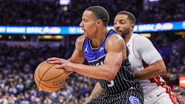 Dec 9, 2025; Orlando, Florida, USA; Orlando Magic guard Desmond Bane (3) drives to the basket against Miami Heat guard Norman Powell (24) during the second half at Kia Center. Mandatory Credit: Mike Watters-Imagn Images