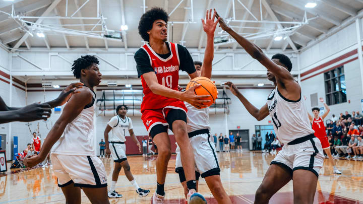 NBA Academy Select forward Oscar Wembanyama attempts a layup between multiple defenders during the NBA Academy Games in Atlanta, Ga.