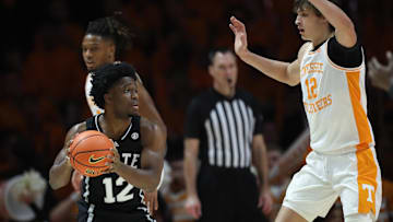 Jan 21, 2025; Knoxville, Tennessee, USA; Mississippi State Bulldogs guard Josh Hubbard (12) looks to move the ball against Tennessee Volunteers forward Cade Phillips (12) during the first half at Thompson-Boling Arena at Food City Center. Mandatory Credit: Randy Sartin-Imagn Images