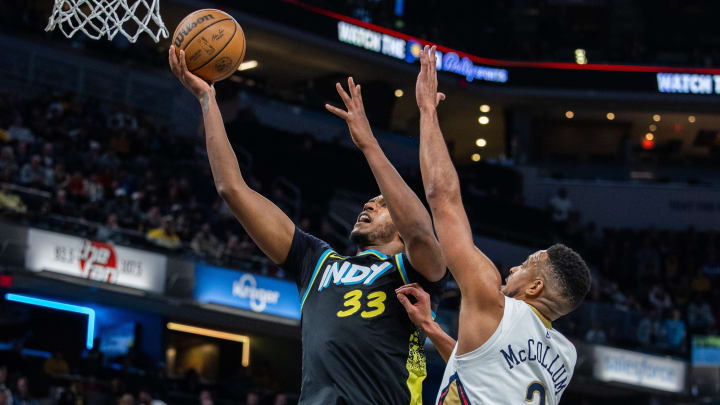 Feb 28, 2024; Indianapolis, Indiana, USA; Indiana Pacers center Myles Turner (33) shoots the ball while New Orleans Pelicans guard CJ McCollum (3) defends in the second half at Gainbridge Fieldhouse. 