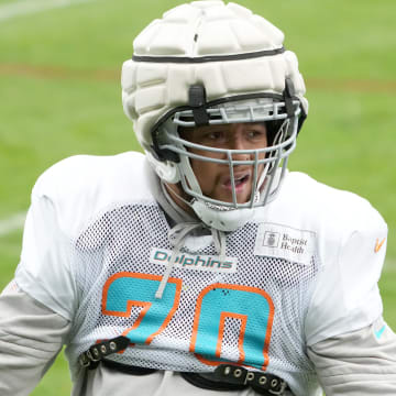 Miami Dolphins offensive tackle Kendall Lamm wears a Guardian helmet cap during practice at the PSD Bank Arena in Germany before the Week 9 game against the Kansas City Chiefs in 2023.