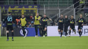 Milan Skriniar and his teammates race to celebrate Inter's winning goal with the assist provider, Alessandro Bastoni (left)