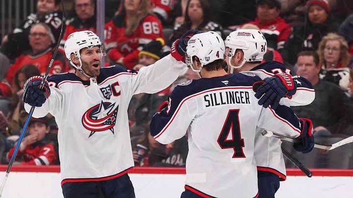 Boone Jenner and Cole Sillinger celebrate Mathieu Olivier's goal against the New Jersey Devils