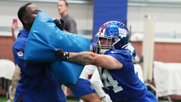 Eat Rutherford, NJ -- May 9, 2025 -- Inside linebacker coach John Egorugwu and Cam Skattebo during practice at Giants Rookie Minicamp.