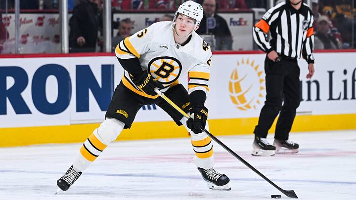 Mar 17, 2026; Montreal, Quebec, CAN; Boston Bruins defenseman Mason Lohrei (6) plays the puck against the Montreal Canadiens during the first period at Bell Centre. Mandatory Credit: David Kirouac-Imagn Images