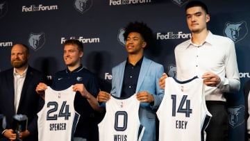 Grizzlies head coach Taylor Jenkins and the team’s 2024 NBA Draft picks Cam Spencer, Jaylen Wells, and Zach Edey hold up their jerseys during a press conference to introduce the team’s picks at FedExForum on Friday, June 28, 2024.