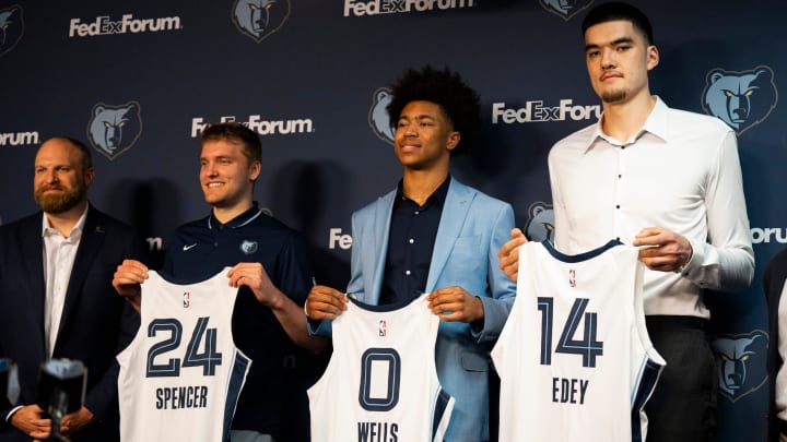 Grizzlies head coach Taylor Jenkins and the team’s 2024 NBA Draft picks Cam Spencer, Jaylen Wells, and Zach Edey hold up their jerseys during a press conference to introduce the team’s picks at FedExForum on Friday, June 28, 2024.