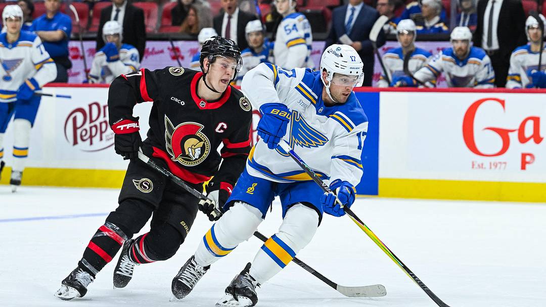 Dec 6, 2025; Ottawa, Ontario, CAN; St. Louis Blues defenseman Cam Fowler (17) defends against Ottawa Senators left wing Brady Tkachuk (7) during the third period at Canadian Tire Centre. Mandatory Credit: David Kirouac-Imagn Images