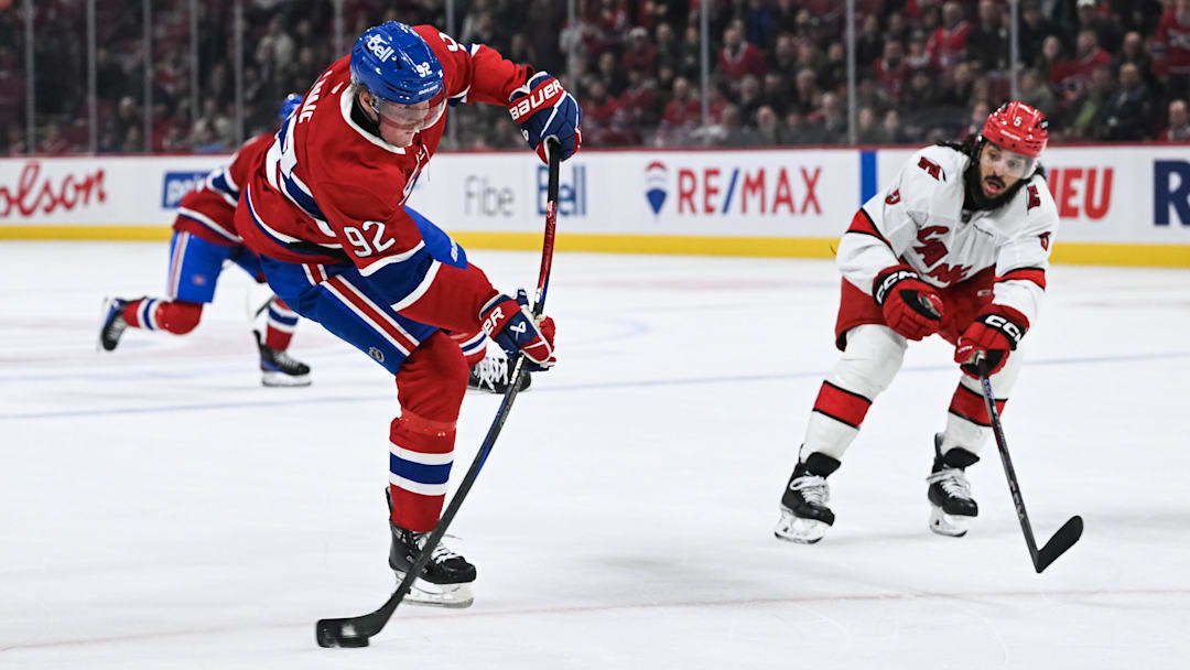 Feb 25, 2025; Montreal, Quebec, CAN; Montreal Canadiens right wing Patrik Laine (92) shoots the puck against the Carolina Hurricanes in the third period at Bell Centre. Mandatory Credit: David Kirouac-Imagn Images