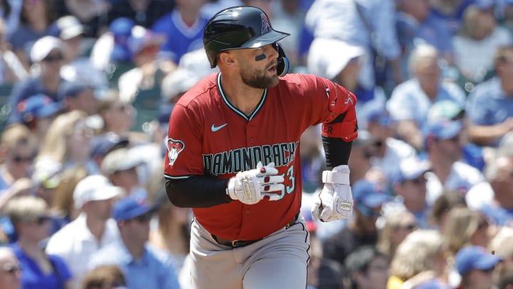 Jul 19, 2024; Chicago, Illinois, USA; Arizona Diamondbacks first baseman Christian Walker (53) watches his two-run single against the Chicago Cubs during the third inning at Wrigley Field.