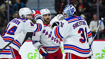 Dec 4, 2025; Ottawa, Ontario, CAN; New York Rangers players gather around goalie Igor Shesterkin (31) to celebrate their win against the Ottawa Senators at Canadian Tire Centre. Mandatory Credit: David Kirouac-Imagn Images