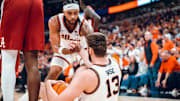 Illinois guard Kylan Boswell lifts teammate Tomislav Ivisic (13) during the Illini's 90-86 loss to Alabama on Wednesday at the United Center in Chicao.