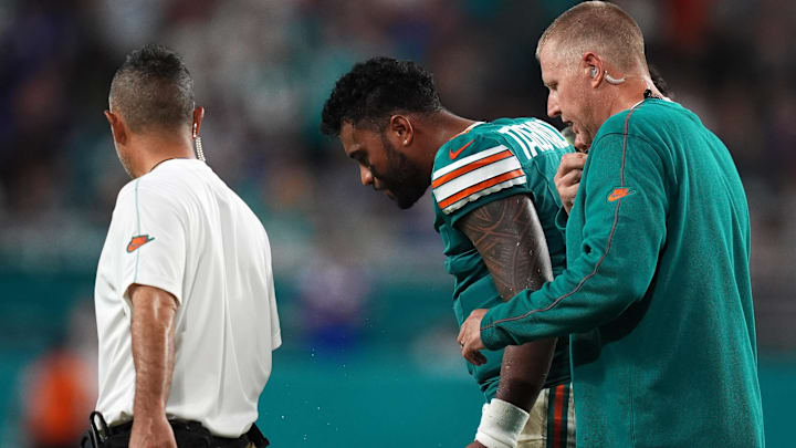 Miami Dolphins quarterback Tua Tagovailoa (1) walks off the field,