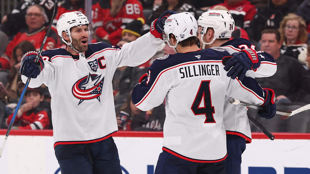 Blue Jackets players Boone Jenner, Cole Sillinger, and Mathieu Olivier celebrate a goal against the New Jersey Devils. Blue Jackets players Boone Jenner, Cole Sillinger, and Mathieu Olivier celebrate a goal against the New Jersey Devils.