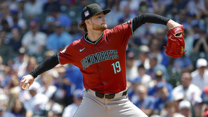 Jul 19, 2024; Chicago, Illinois, USA; Arizona Diamondbacks starting pitcher Ryne Nelson (19) delivers a pitch against the Chicago Cubs during the first inning at Wrigley Field. Mandatory Credit: Kamil Krzaczynski-USA TODAY Sports