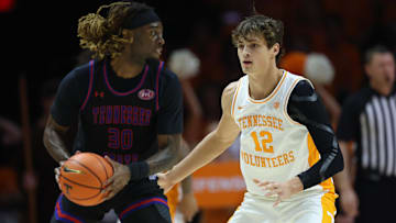 Nov 20, 2025; Knoxville, Tennessee, USA;  Tennessee Volunteers forward Cade Phillips (12) defends Tennessee State Tigers forward Aaron Nkrumah (30) during the first half at Thompson-Boling Arena at Food City Center. Mandatory Credit: Randy Sartin-Imagn Images