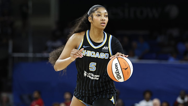 Aug 25, 2024; Chicago, Illinois, USA; Chicago Sky forward Angel Reese (5) looks to pass the ball against the Las Vegas Aces during the first half at Wintrust Arena. 