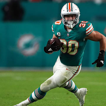 Dec 24, 2023; Miami Gardens, Florida, USA; Miami Dolphins fullback Alec Ingold (30) runs with the ball during the second half against the Dallas Cowboys at Hard Rock Stadium.