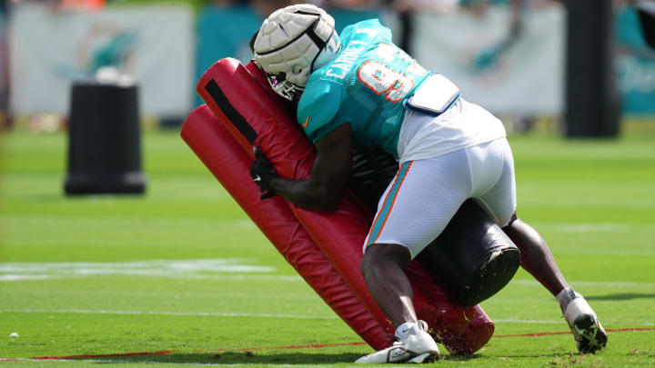 Aug 2, 2022; Miami Gardens, Florida, US; Miami Dolphins defensive lineman Owen Carney Jr. (93) runs a drill during training camp at Baptist Health Training Complex. Mandatory Credit: Jasen Vinlove-USA TODAY Sports