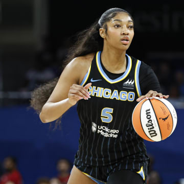 Aug 25, 2024; Chicago, Illinois, USA; Chicago Sky forward Angel Reese (5) looks to pass the ball against the Las Vegas Aces during the first half at Wintrust Arena. Mandatory Credit: Kamil Krzaczynski-USA TODAY Sports