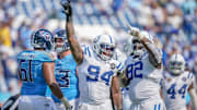 Sep 21, 2025; Nashville, Tennessee, USA; Indianapolis Colts defensive end Tyquan Lewis (94) celebrates sacking Tennessee Titans quarterback Cam Ward (1) during the fourth quarter at Nissan Stadium. Mandatory Credit: Andrew Nelles-USA TODAY Network via Imagn Images