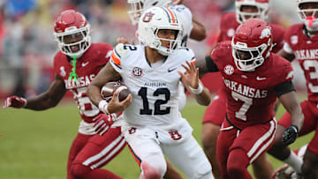 Oct 25, 2025; Fayetteville, Arkansas, USA; Auburn Tigers quarterback Ashton Daniels (14) rushes during the third quarter against the Arkansas Razorbacks at Donald W. Reynolds Razorback Stadium. Mandatory Credit: Nelson Chenault-Imagn Images