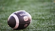 Nov 9, 2024; Montreal, Quebec, CAN; View of a CFL game ball on the field with the french logo during warm-up before the game betweem Toronto Argonauts and Montreal Alouettes at Percival-Molson Memorial Stadium. Mandatory Credit: David Kirouac-Imagn Images