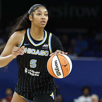 Aug 25, 2024; Chicago, Illinois, USA; Chicago Sky forward Angel Reese (5) looks to pass the ball against the Las Vegas Aces during the first half at Wintrust Arena. Mandatory Credit: Kamil Krzaczynski-USA TODAY Sports