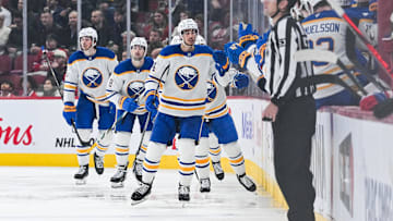 Dec 17, 2024; Montreal, Quebec, CAN; Buffalo Sabres center Dylan Cozens (24) celebrates his goal with his teammates at the bench against the Montreal Canadiens during the second period at Bell Centre. Mandatory Credit: David Kirouac-Imagn Images