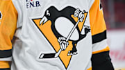 Dec 12, 2024; Montreal, Quebec, CAN; View of a Pittsburgh Penguins logo on a jersey worn by a member of the team during the second period at Bell Centre. Mandatory Credit: David Kirouac-Imagn Images