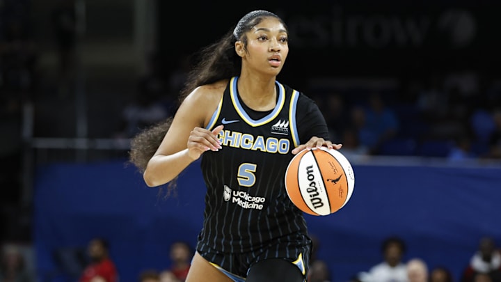 Aug 25, 2024; Chicago, Illinois, USA; Chicago Sky forward Angel Reese (5) looks to pass the ball against the Las Vegas Aces during the first half at Wintrust Arena. 