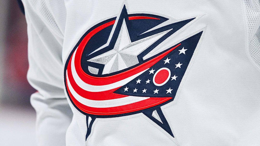 Mar 12, 2024; Montreal, Quebec, CAN; View of a Columbus Blue Jackets logo on a jersey worn by a member of the team during warm-up before the game against the Montreal Canadiens at Bell Centre. Mandatory Credit: David Kirouac-Imagn Images