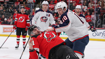 Blue Jackets forward Dmitri Voronkov fights Devils forward Stefan Noesen. 