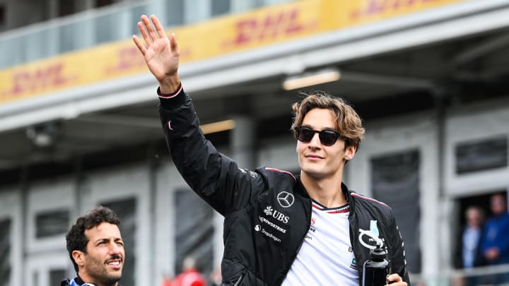 Jun 9, 2024; Montreal, Quebec, CAN; Mercedes driver George Russell (GBR) salutes the crowd during the drivers parade of the Canadien Grand Prix at Circuit Gilles Villeneuve. Mandatory Credit: David Kirouac-USA TODAY Sports