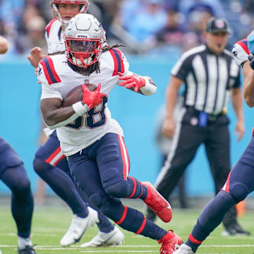 New England Patriots running back Rhamondre Stevenson (38) runs the ball against the Tennessee Titans during the first quarter at Nissan Stadium in Nashville, Tenn., Sunday, Oct. 19, 2025.