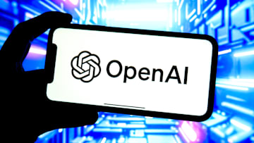 In this photo illustration, an OpenAI logo is seen displayed...