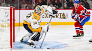 Jan 12, 2023; Montreal, Quebec, CAN; Nashville Predators goalie Yaroslav Askarov (30) shoots the puck away from his net against the Montreal Canadiens during the second period at Bell Centre. Mandatory Credit: David Kirouac-USA TODAY Sports