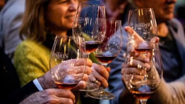 People make a toast during the Essence of Wine event...